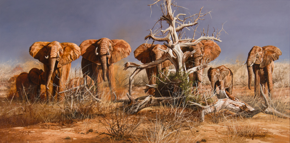 Herd of African elephants gathered around a gnarled, leafless tree in a dry savanna under a muted sky.