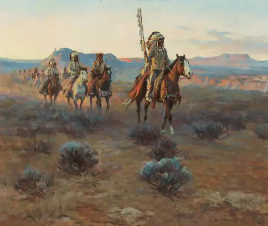 A line of Native American riders on horseback crosses a desert plain, led by a rider with a tall feathered headdress and staff, with distant mesas on the horizon.