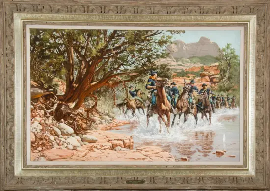 Framed painting of cavalry riding through a shallow river in a rocky desert landscape with a large tree nearby.