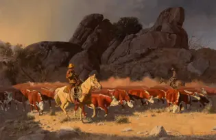 Cowboys on horseback guiding a herd of red and white cattle through a dusty, rocky landscape with large rock formations in the background.
