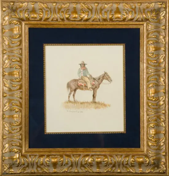Small watercolor of a cowboy in a hat riding a brown horse, set against a pale background and displayed in a gold ornate frame with a dark blue mat.”] ,
