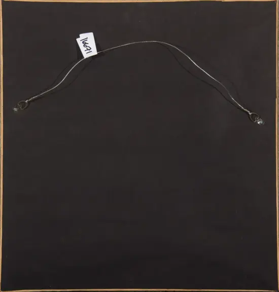 Thin silver lead wire with small clamp ends, curved across a dark display, tag reads 1967.