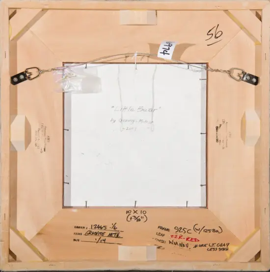 Back of a framed canvas: a white painting surface centered with a hanging wire across the top, brass brackets on each side, and handwritten notes and measurements on the wooden frame edges.