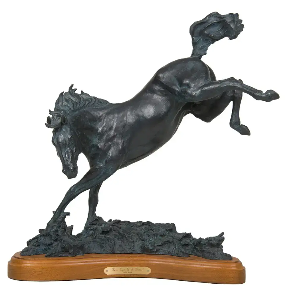 Bronze sculpture of a rearing horse on a rocky base, mounted on a wooden plaque.