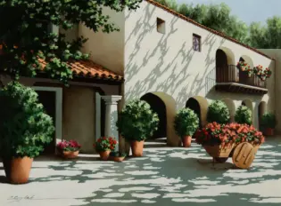 A sunlit Mediterranean courtyard with white stucco walls, arched doorways, and several potted plants along the walkway; a wooden wheelbarrow filled with red flowers sits in the foreground.