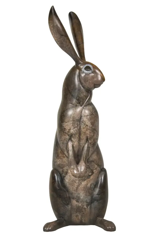 Bronze rabbit statue standing upright with long ears, textured surface, on a flat base