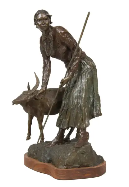 Bronze sculpture of a woman leaning on a staff beside a deer on a rocky base, mounted on a wooden plinth.
