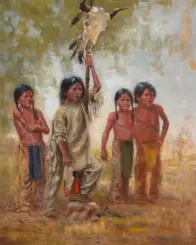 Indigenous man with four children outdoors, raising a staff topped with an eagle head.