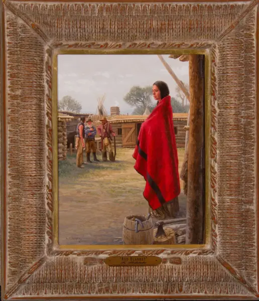 Framed painting of a Native American woman in a bright red blanket standing outdoors near a log village.