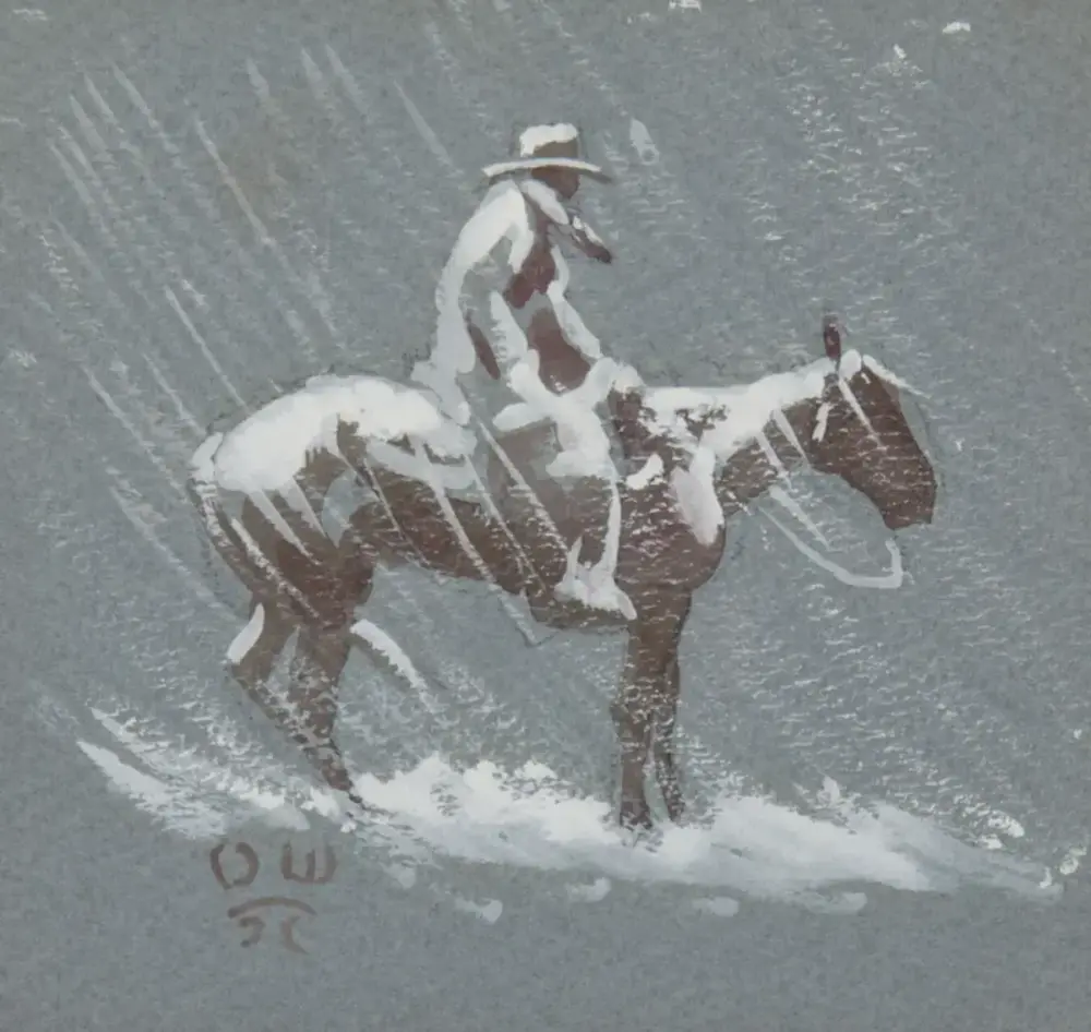 Man wearing a hat rides a snow-covered horse through a snowy landscape in winter.