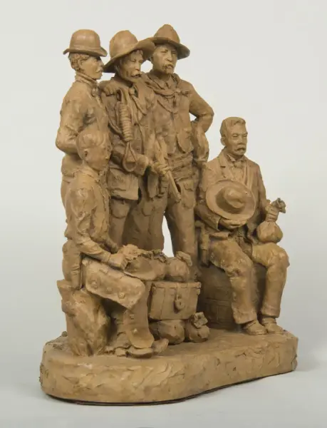 Clay sculpture of five men in vintage mining outfits, standing together with one seated man holding a hat on his lap, on a rough base.