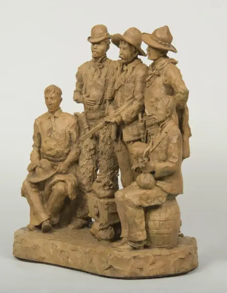 Clay sculpture of a group of men, some seated and others standing, wearing hats and period clothing like suspenders and coats, posed together on a base.
