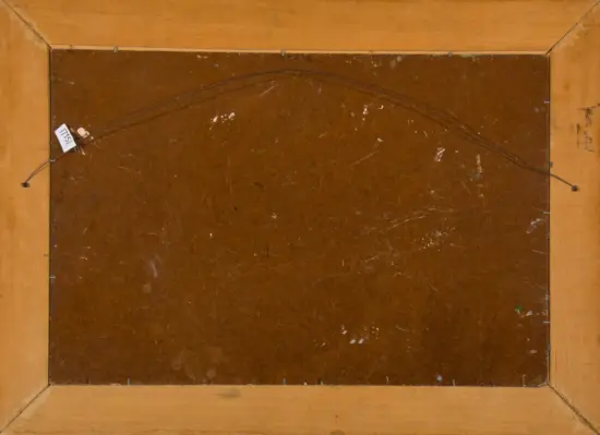 Back of a framed artwork showing hanging wire and a small tag on the left side.