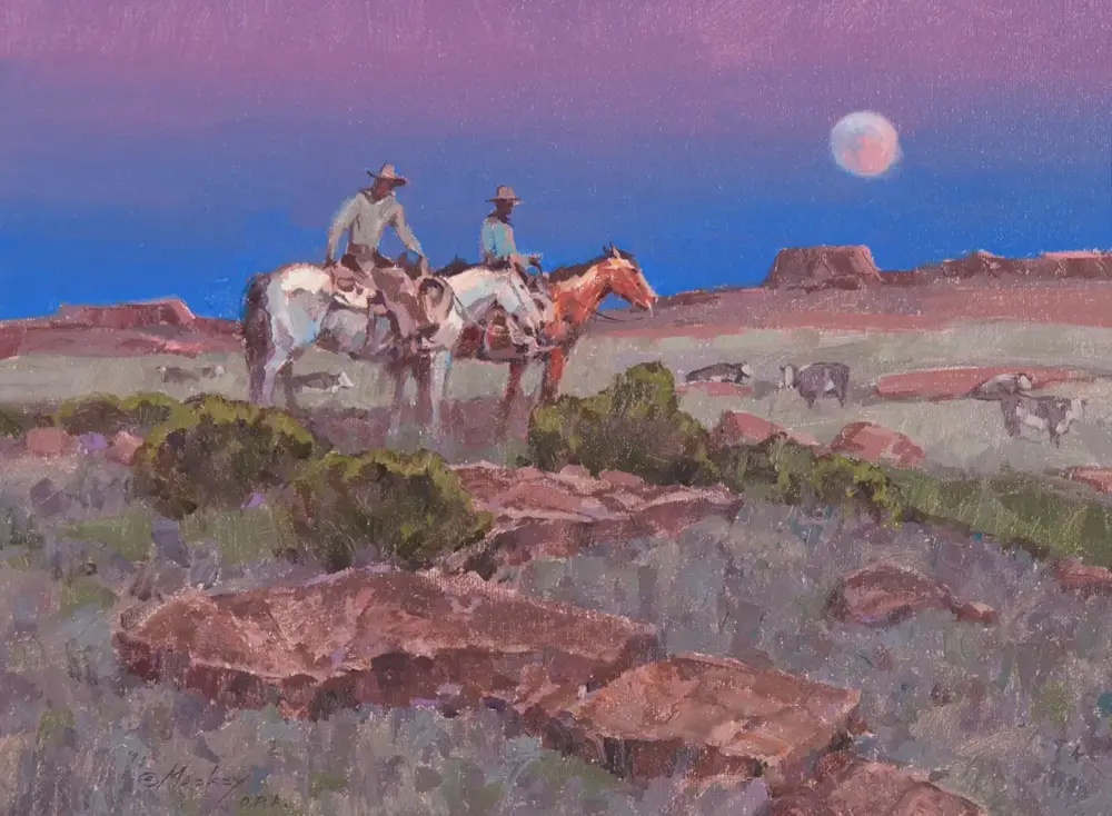 Two cowboys ride on horseback across a desert landscape under a purple twilight sky with a full moon to the right.