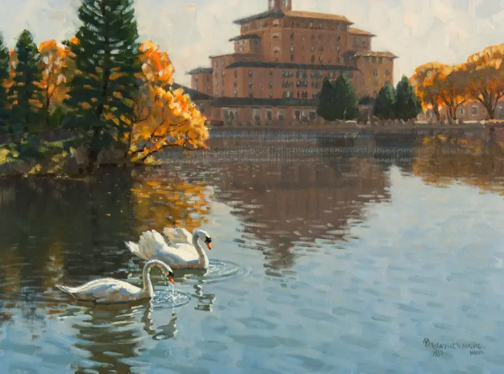 Impressionist painting of a lake with two white swans in the foreground, a brick castle-like building on the far shore, and autumn orange trees reflected in the water.
