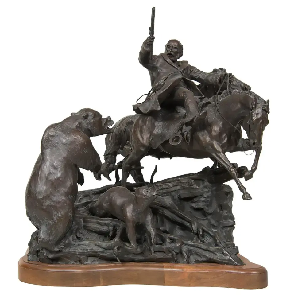 Bronze sculpture of a mounted rider raising a pistol while charging forward, with figures struggling beneath and a wooden base.