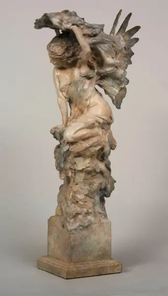 Bronze sculpture of a nude female figure with arms raised, surrounded by flowing, wind-swept forms, on a square pedestal.