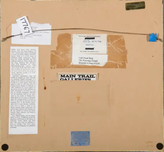 Back of a framed artwork with hanging wire, multiple labels and clippings, including a 'Main Trail Galleries' card and a Bradford Brinton Memorial label.