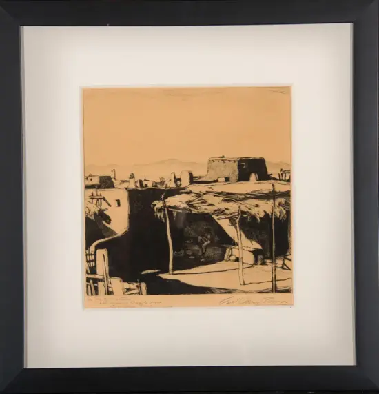 Framed ink drawing of a desert pueblo with thatched huts in the foreground and a large flat-topped fortress on a distant hill under a clear sky.