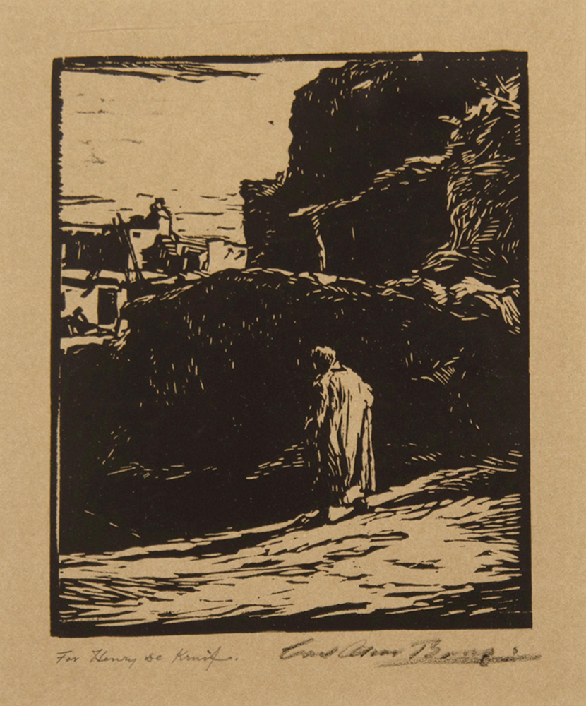 A lone figure walking along a rocky coastal path beside a large cliff with the sea on the left (woodcut style).
