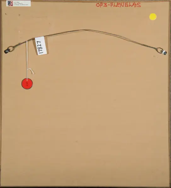 Back of a framed artwork: a curved hanging wire attached to two D-rings along the top edge, with a white tag marked '1787' and a red circular tag dangling from a string, plus a small label in the top-left corner and red handwritten text along the top edge of the frame.