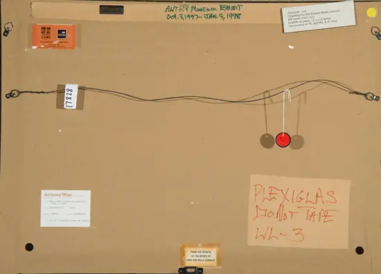 Back of a framed artwork showing a hanging wire, red circular tags, and several labels/stickers affixed to the mat board.