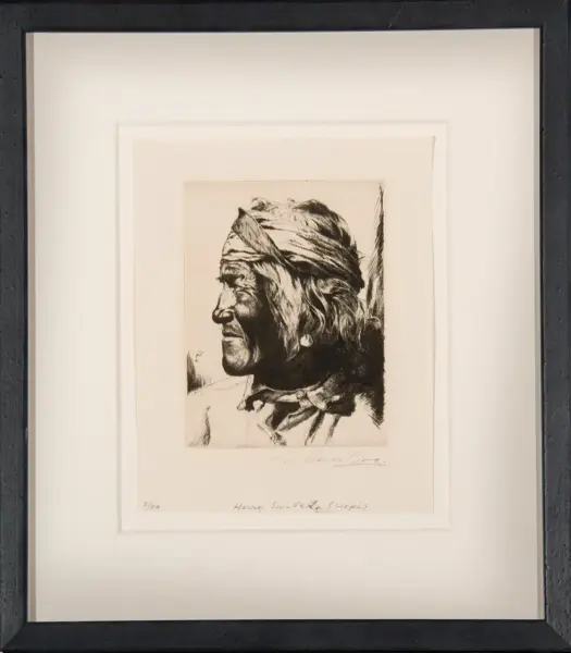 Framed black-and-white profile sketch of a Native American man facing left, wearing a headband, mounted in a light matting frame.