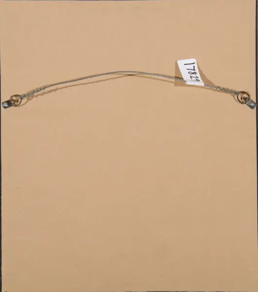 Delicate silver bracelet with small end clasps laid in a gentle arc on a tan background, tag labeled 17829 attached on one side