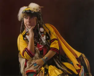 Portrait of a woman in colorful Native American ceremonial regalia with beadwork and feathers, resting her chin on her hand against a dark background.