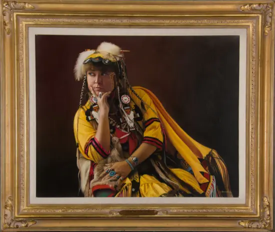 Portrait of a Native American woman in bright traditional clothing and feathered headdress, posed thoughtfully in a gilded frame.