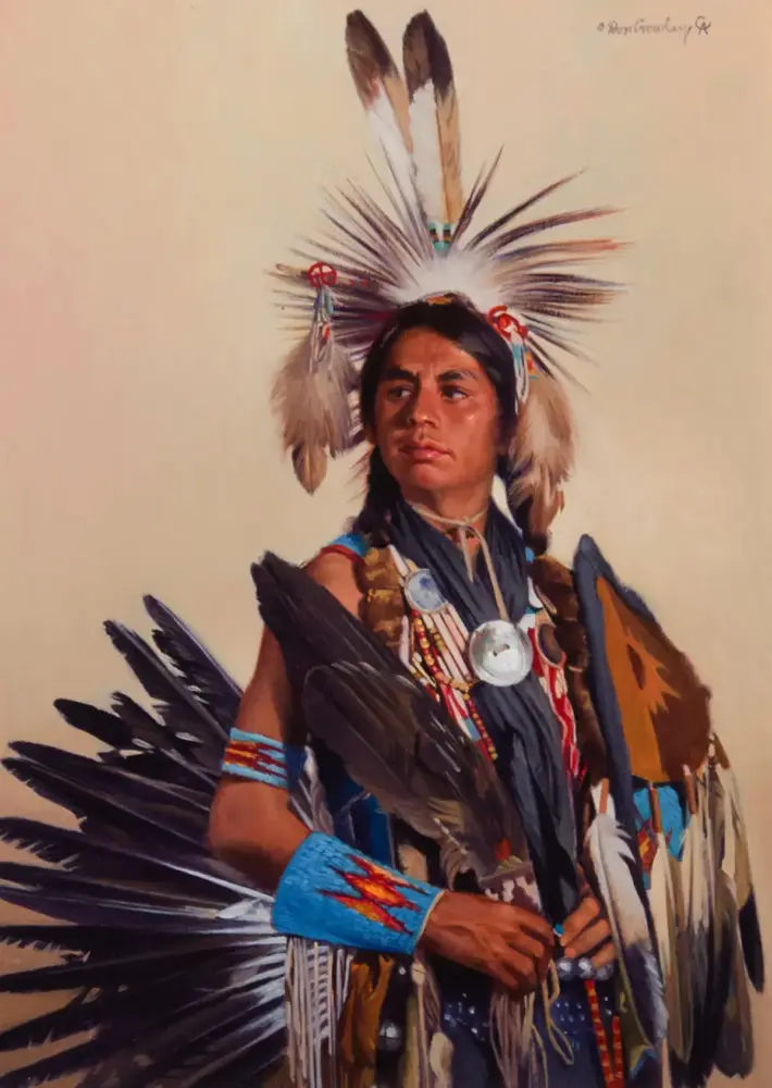 Portrait of a Native American man in ceremonial regalia, wearing a feather headdress, beaded bracelets, and traditional attire.