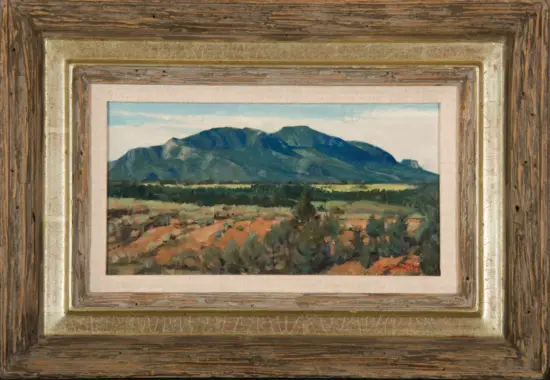 Oil painting of a mountain range with green hills under a blue sky, framed with weathered wood and gold trim.