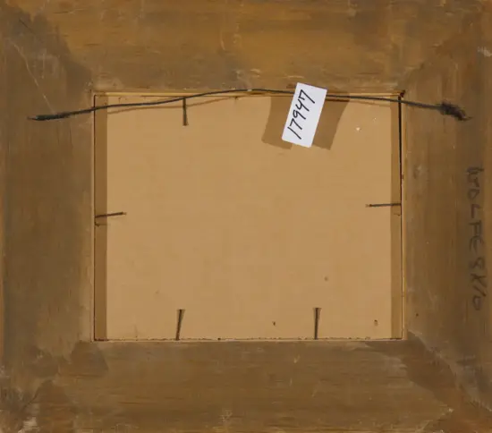 Back of a framed artwork showing a metal hanging wire, cardboard backing, and a white tag with handwritten numbers attached