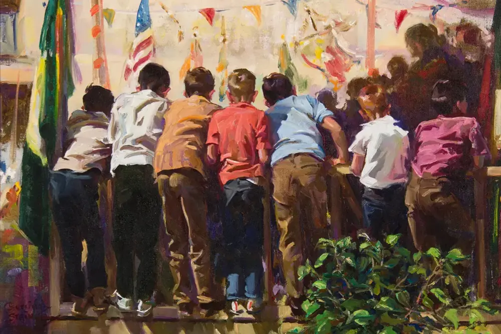Group of children leaning over a railing at a colorful festival with flags overhead