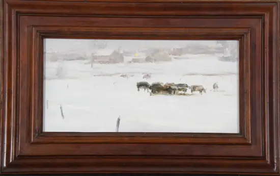 Framed winter landscape: a small herd of horses in a snow-covered field.