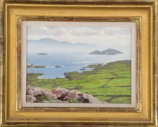 Gold-framed landscape painting of a rocky shoreline with green fields, calm blue sea, and distant islands under a cloudy sky.