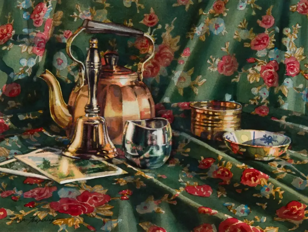 Still life with a brass teapot, copper kettle, metal cup, and small bowls on a green floral fabric backdrop.