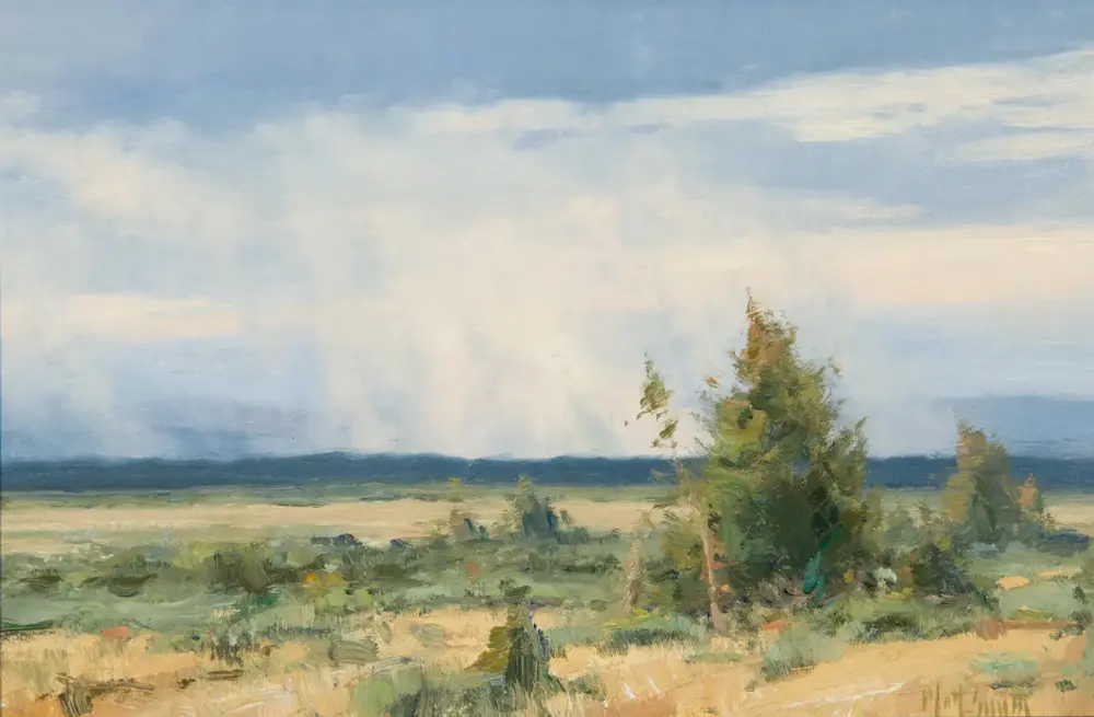 Impressionistic landscape: blue sky with pale clouds, distant horizon, and wind-swept trees in the foreground.