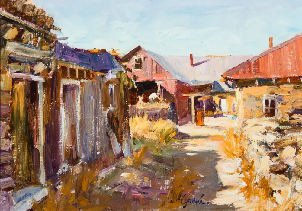 Colorful impressionist village street with weathered wooden huts and red-tiled roofs beneath a bright blue sky.