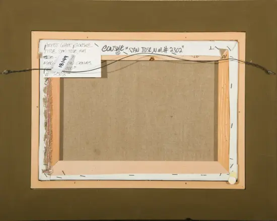 Back of a stretched canvas on a wooden frame, with a black hanging wire across the top and several handwritten notes taped to the edge.