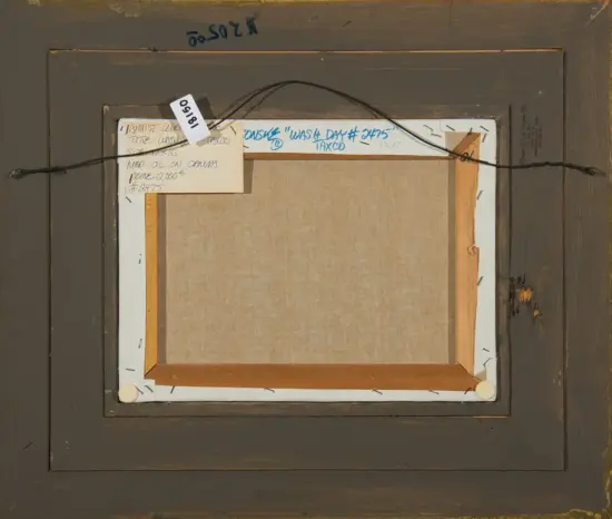Back of framed artwork showing hanging wire, wooden stretcher bars, and tag labels attached to the frame edge