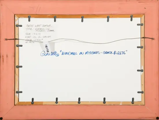 Back view of a framed canvas with a pink border, metal clamps along the edges, and a handwritten note in blue reading “Windmill on Mykonos – Greece #2676.”