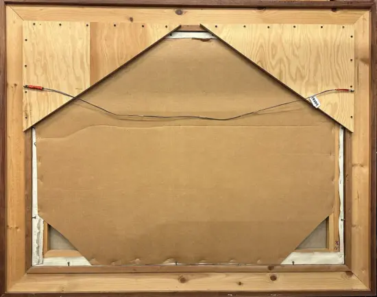 Back of a framed painting: wooden frame with cardboard backing and a triangular bracing piece at the top, wires for hanging on each side with red tape ends.