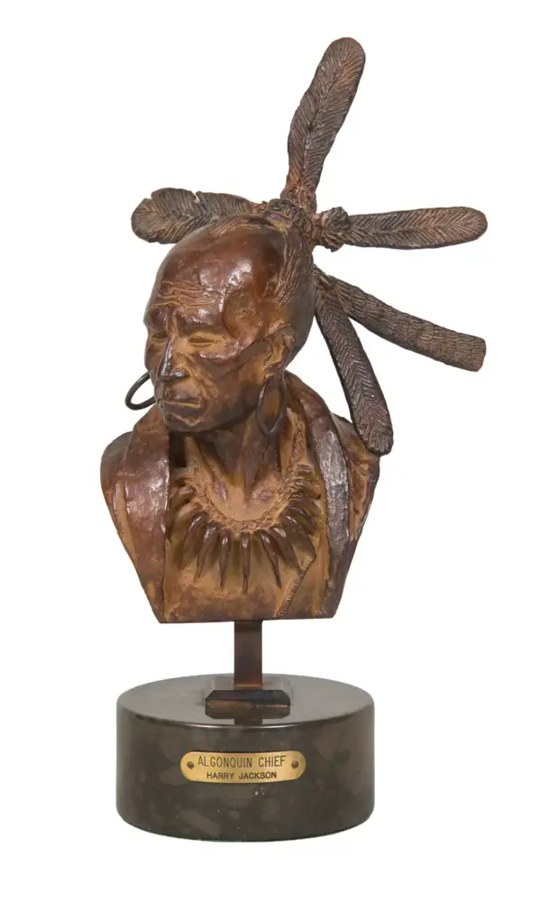 Bronze bust sculpture of Algonquin Chief Harry Jackson wearing a feathered headdress on a round pedestal plaque reads 'Algonquin Chief Harry Jackson'