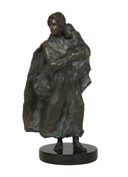 Bronze sculpture of a woman in a cloak holding a child on her shoulder, standing on a round black pedestal.