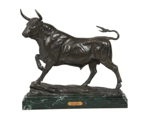 Bronze statue of a bull in mid-stride on a marble base with an inscribed plaque underneath.