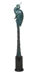 Abstract teal patina sculpture of a tall bird perched on a textured column, mounted on a black pedestal