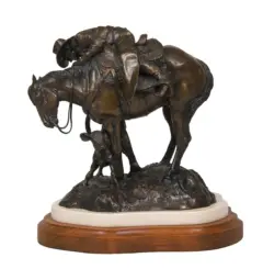 Bronze sculpture of a horse and rider with a small child standing beside them, mounted on a wooden pedestal.
