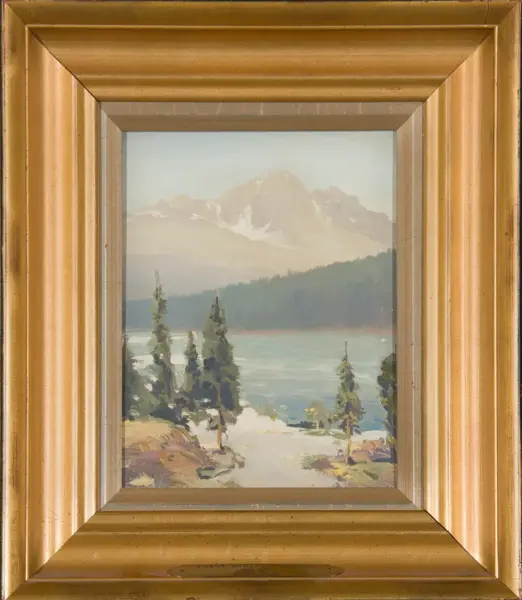 Oil painting of a mountain lake scene with evergreen trees and snow-capped peaks, in a gold ornate frame.