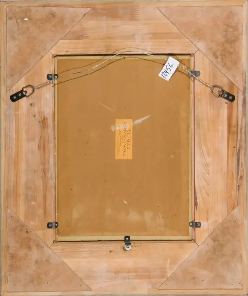 Back of a wooden-framed painting with metal hanging wire, D-rings, and corner braces on a brown backing board; label at center.